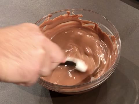 The milk chocolate is completely melted in the bowl