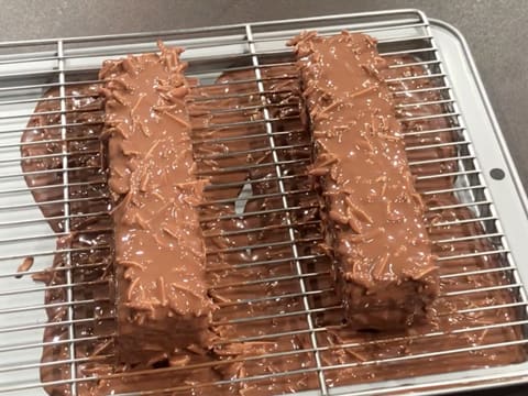 Both cakes are coated with icing