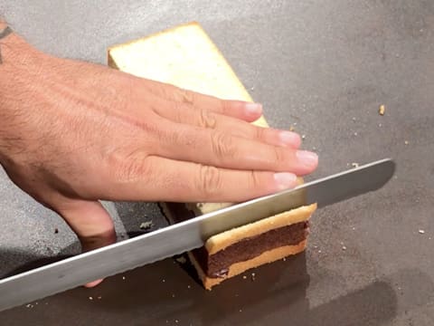 Trim the crust on one end of the cake