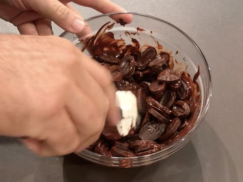 Stir the dark chocolate while melting with a rubber spatula