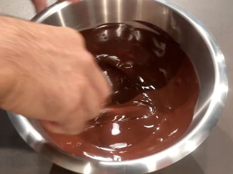 Stir the melted dark chocolate in the bowl