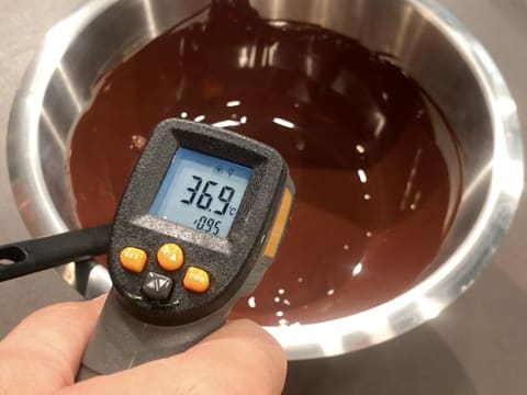 The temperature of the melted dark chocolate shows 36.9°C