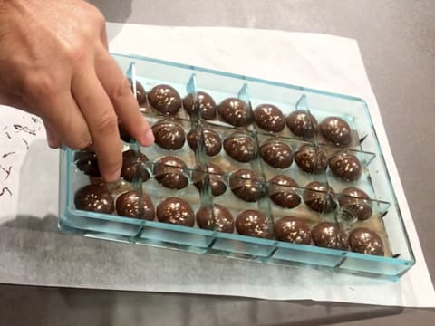 Place the chocolate mould upside down on baking parchment