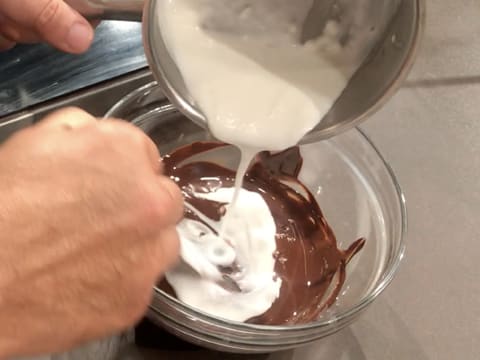 Pour the cream over the melted dark chocolate and stir