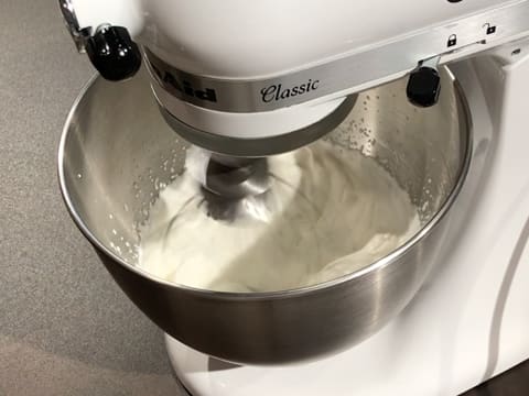Beat the whipping cream in the stand mixer until you get a whipped cream