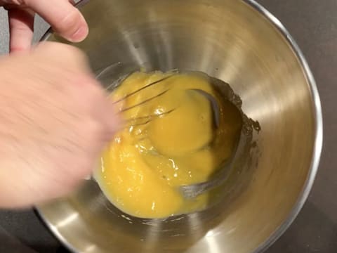 Whisk the egg yolks and castor sugar together