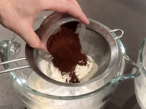 Pour the cocoa powder in the sieve over the bowl