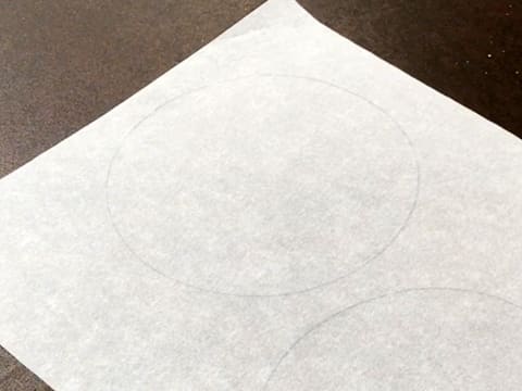 Flip the baking parchment on your workbench so the drawn circles are on the underside