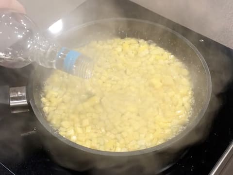 Pour white rum over the fruit cubes inside the pan