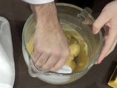 Scrape the dough from the sides of the bowl