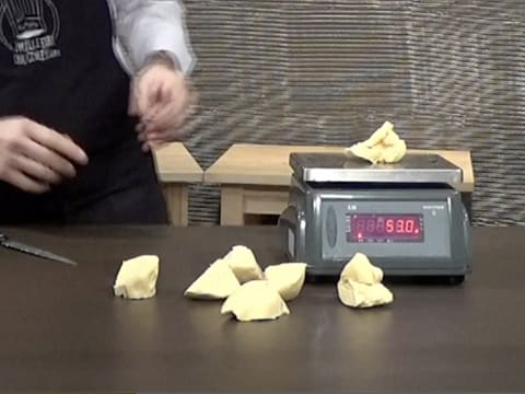 Divide the brioche dough into equal balls with a digital scale