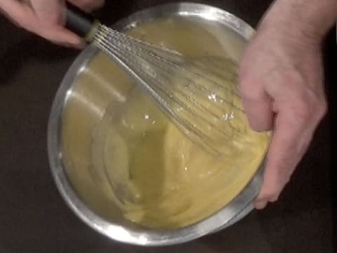 Blanch egg yolks in the mixing bowl