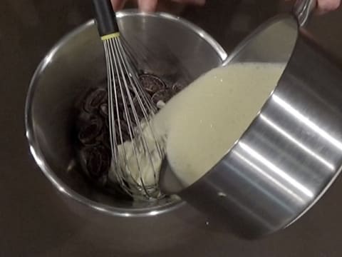 Pour the hot preparation over the dark chocolate