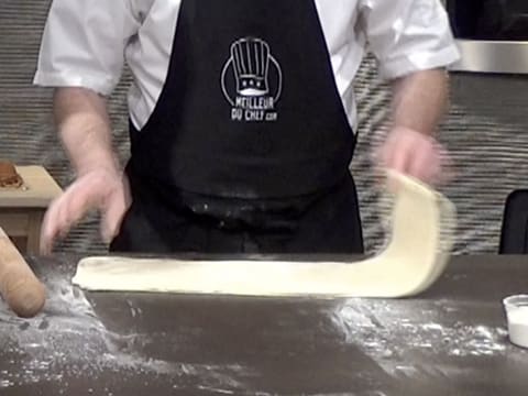 Place the dough horizontally on kitchen workbench