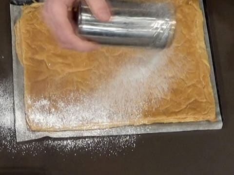 Sprinkle icing sugar over the puff pastry