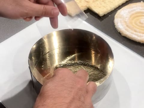 Insert a strip of acetate in the vacherin ring, which is placed on a baking sheet lined with greaseproof paper