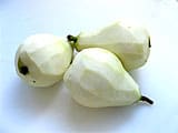 Peel three pears on a chopping board