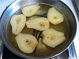 The pears are cooked in the vanilla syrup