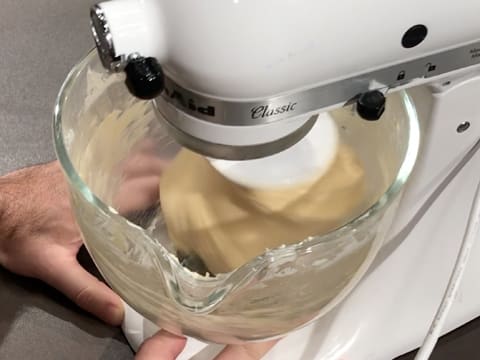 Kneading is in progress, the dough comes away from the sides of the bowl