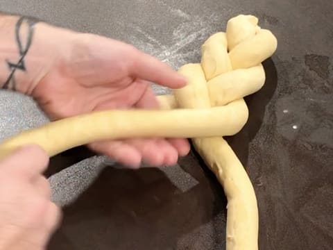 Plait the three strands of brioche dough