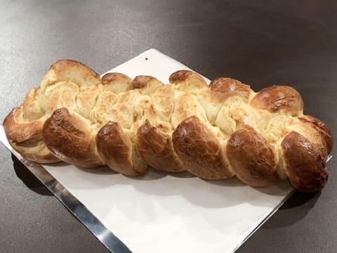 Place the cooked brioche on a baking sheet lined with greaseproof paper