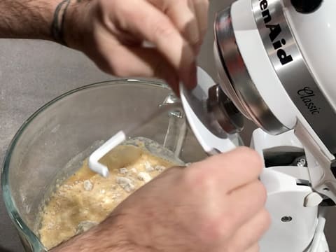 Place the bowl in the food mixer and attach the dough hook