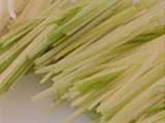 Trimming leeks into a julienne