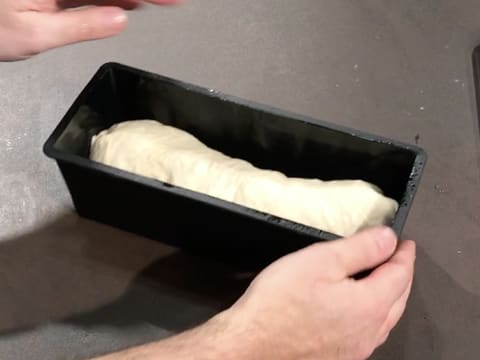 The dough is inside the bread pan