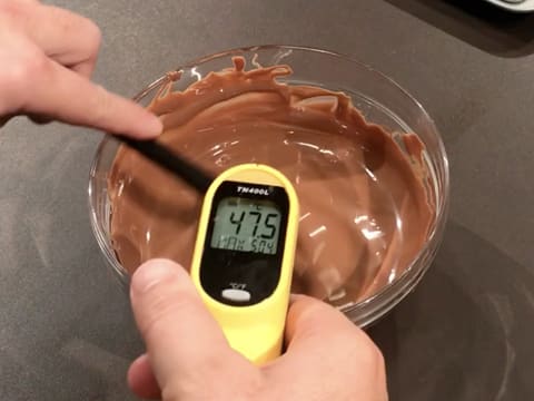 Check the temperature of the melted milk chocolate