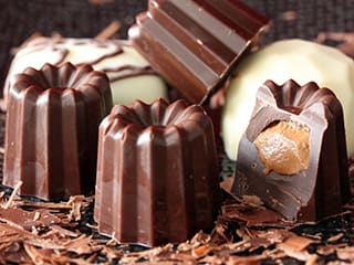 Cannelé Chocolates with a Praline Filling
