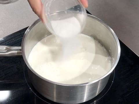 Add sugar to the milk in the saucepan placed on the stove