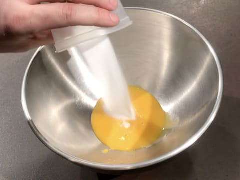 Add the castor sugar to the egg yolks in the bowl