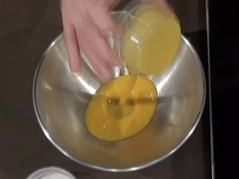 Place the egg yolks in a mixing bowl