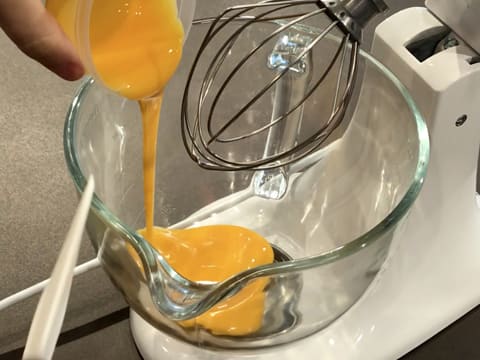 Pour the egg yolks in the stand mixer bowl fitted with the whisk