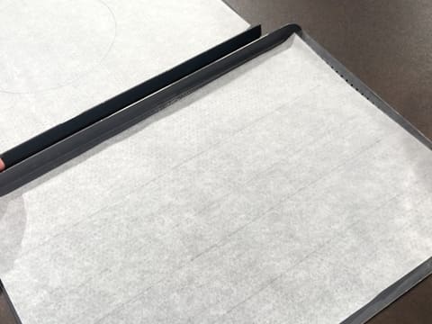 Flip the baking parchment on a perforated baking sheet