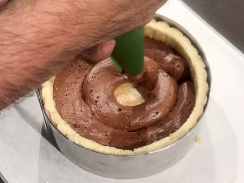 The chocolate mousse is piped at the bottom of the ring