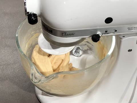 Kneading is in progress, the dough comes away from the sides of the bowl