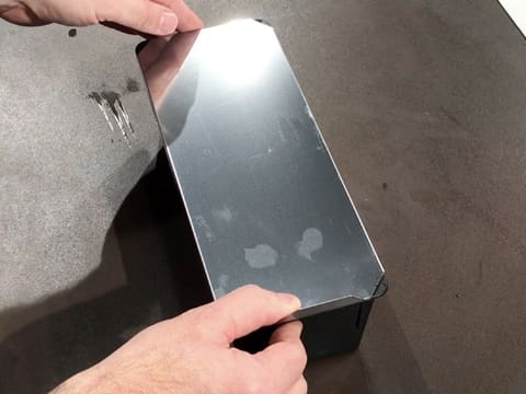 The bread pan is closed on the workbench