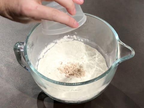 Add the fresh yeast broken into crumbs into the bowl